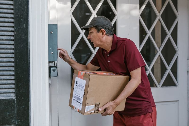 A video doorbell mounted beside a flat's front door