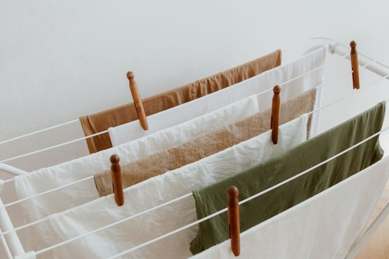 Compact dehumidifier drying laundry inside a flat