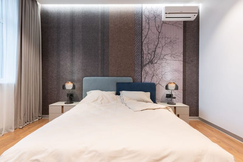 Small cylindrical air purifier in a bedroom corner