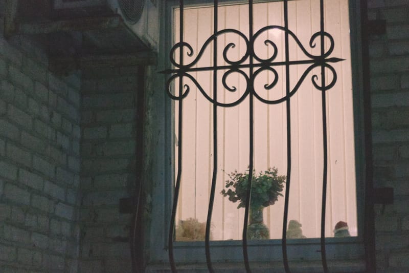 Small indoor outdoor security camera on a window sill